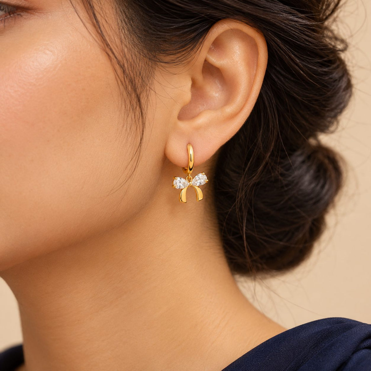 Crystal Bow Huggie Earrings - Model
