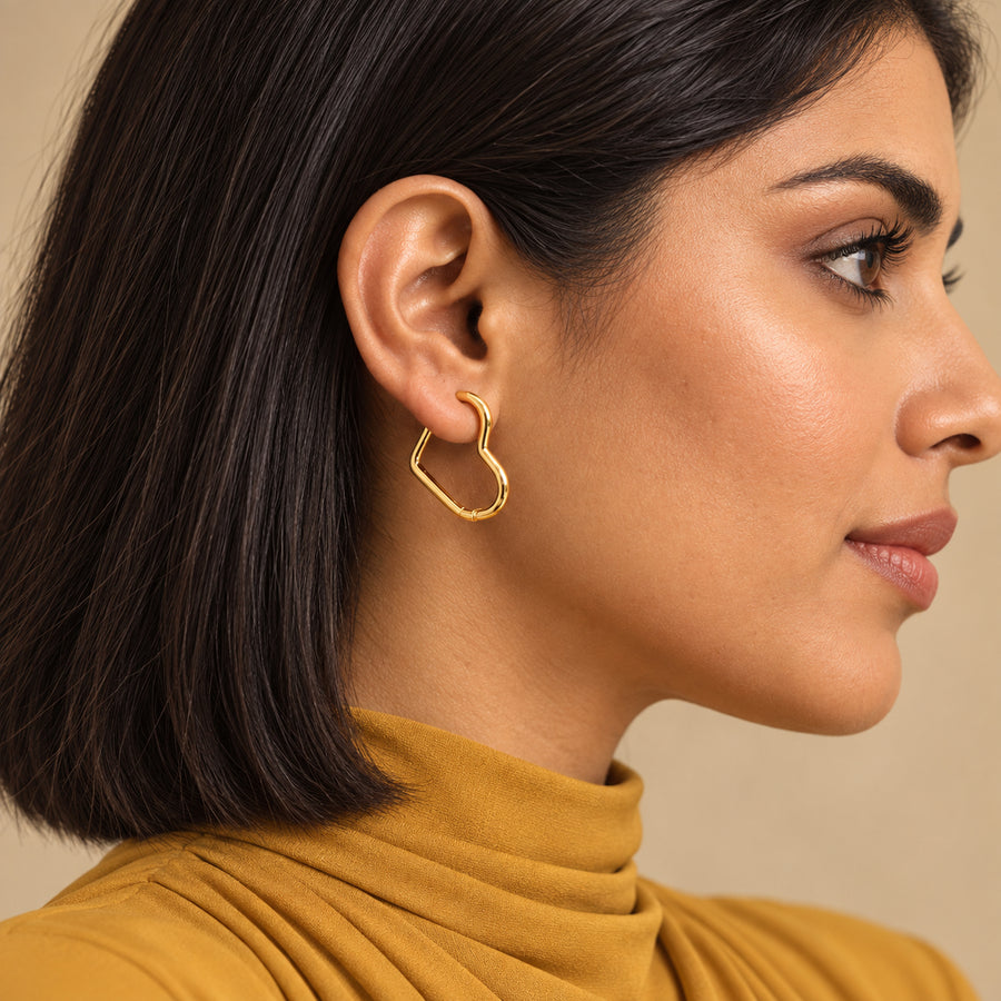 Sculpted Heart Hoop Earrings worn by model