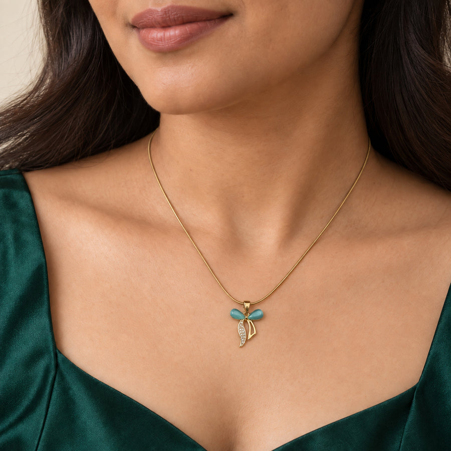 Teal Crystal Bow Pendant Necklace worn by model