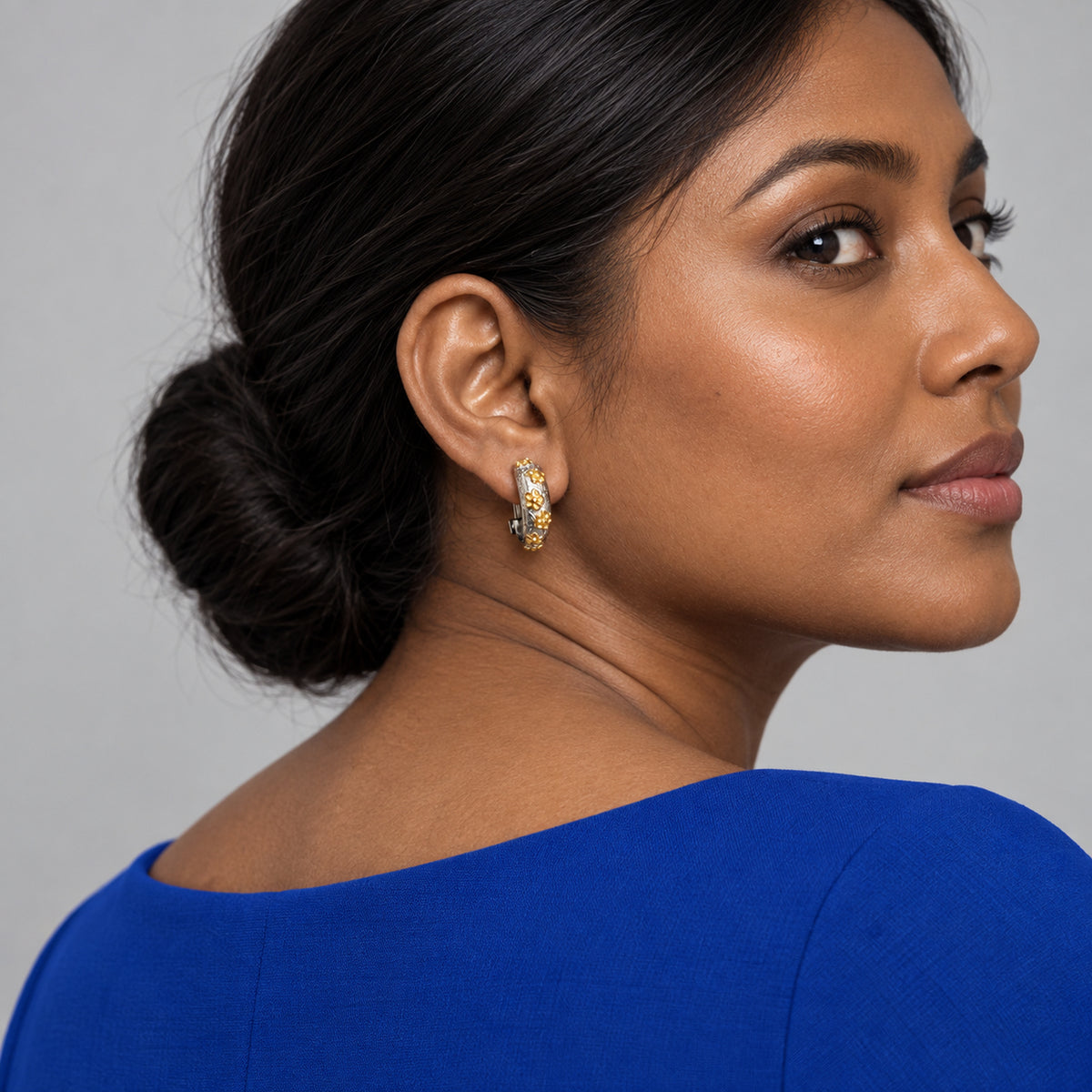 Two-Tone Floral Hoop Earrings worn by model